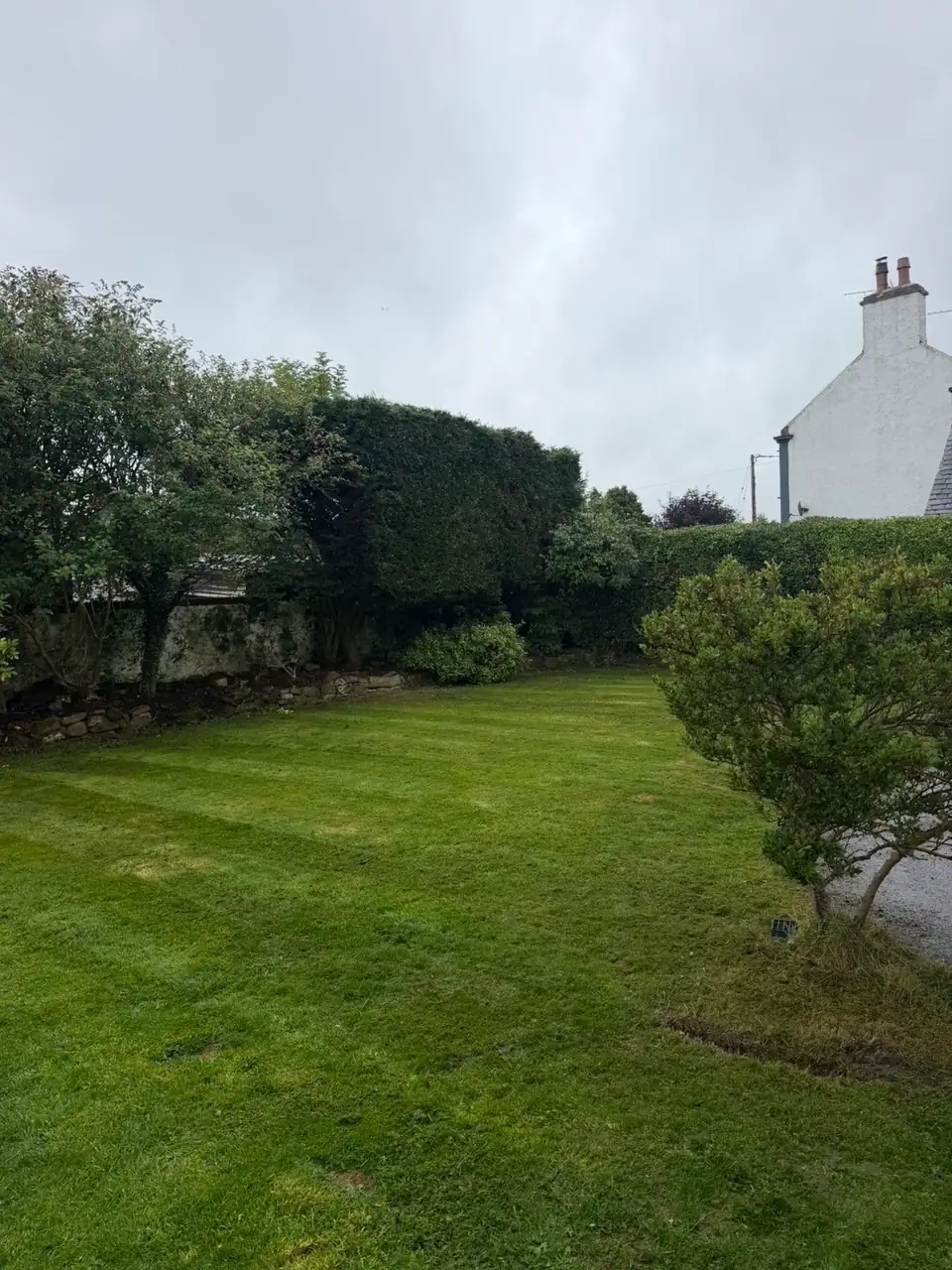 Freshly cut and striped lawn after grass cutting in Lochmaben by RML Ground Maintenance